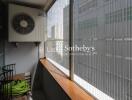 Balcony with air conditioning unit and safety mesh