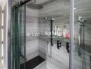 Modern bathroom with glass shower enclosure and built-in shelf