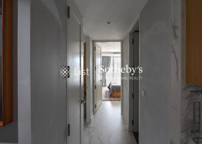 View down a hallway leading to a bedroom