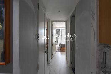 View down a hallway leading to a bedroom