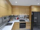 Modern kitchen with wooden cabinets and black appliances