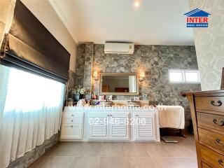 Bedroom with vanity and modern decor