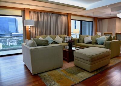 Modern living room with large windows and city view