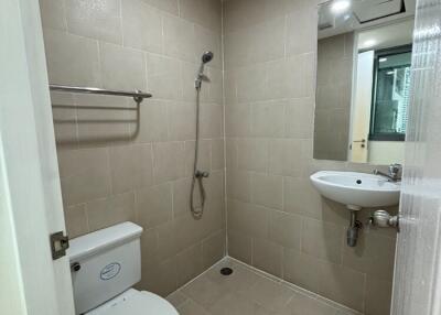 Modern bathroom with shower, toilet, and sink