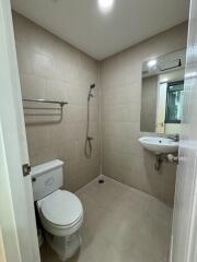 Modern bathroom with shower, toilet, and sink