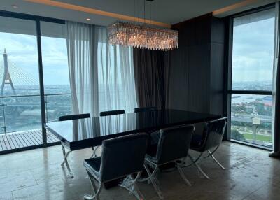 Modern dining room with large windows and a city view