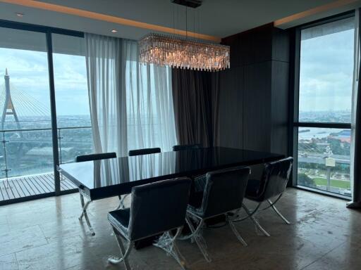 Modern dining room with large windows and a city view