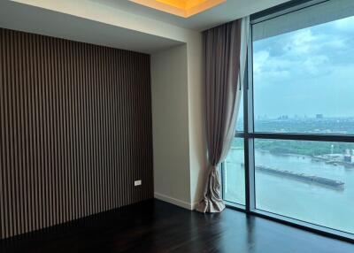 Bedroom with large window and river view