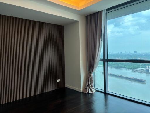 Bedroom with large window and river view