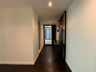 Modern hallway with wooden floor and minimalistic design