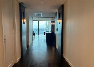 Hallway leading to living area with ocean view