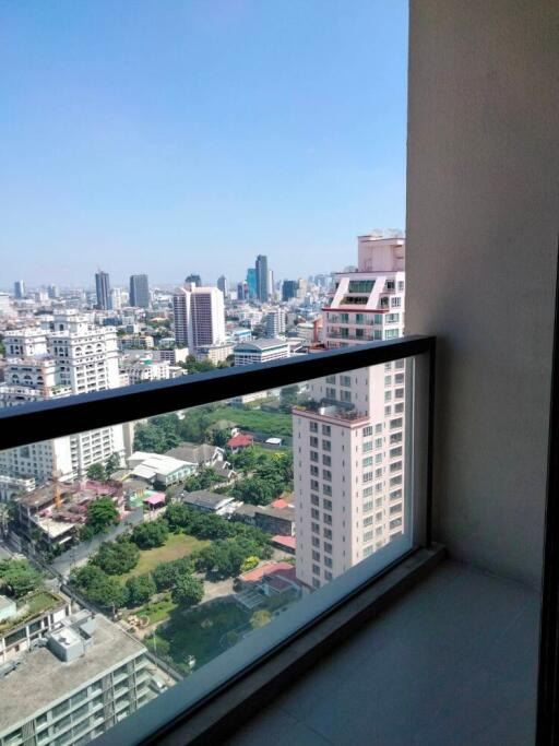 A view of the city skyline from a high-rise balcony