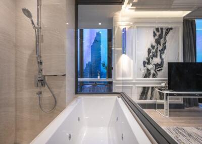 Bathroom with modern bath and adjacent living space