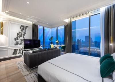 Spacious modern bedroom with large windows and city view