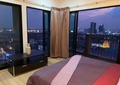 Bedroom with city view at night