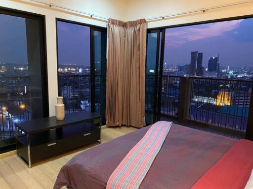 Bedroom with city view at night