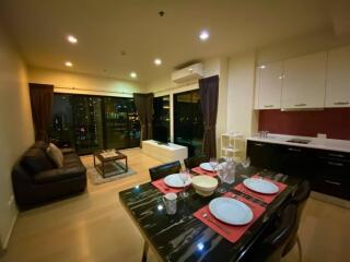 Modern living room and dining area with city view