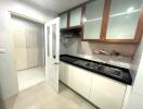 Modern kitchen with white cabinets and double sink