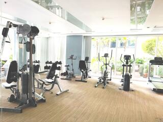 Well-equipped modern gym with cardio and strength training equipment