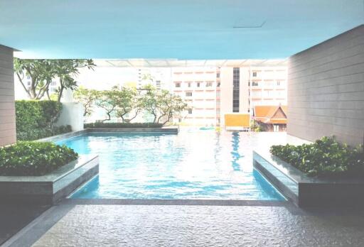 Modern swimming pool area in a building complex