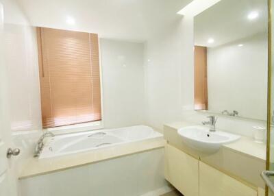 Main bathroom with a bathtub and sink