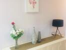 Decorative sideboard with flower vase and table lamp