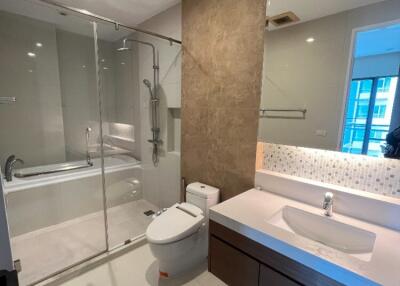 Modern bathroom with glass shower and toilet