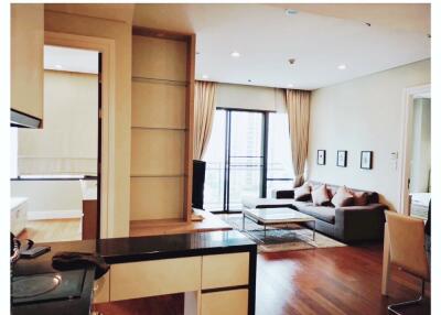 modern living room with kitchen and natural light