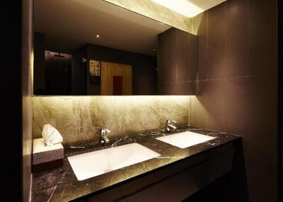 Modern bathroom with double sinks and ambient lighting