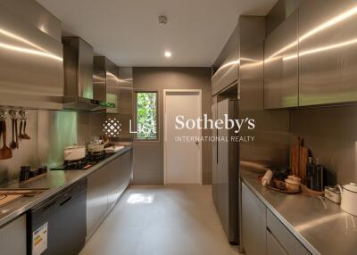 Modern stainless steel kitchen with ample storage and built-in appliances