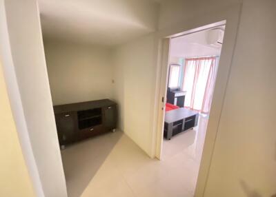 View of entryway leading to living area with large windows