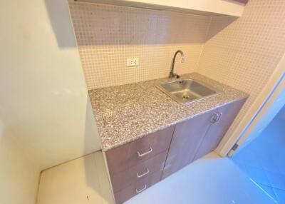 Compact kitchen with granite countertop