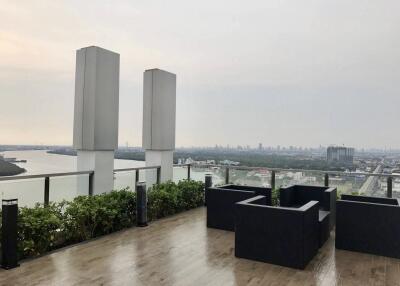 Rooftop with seating area and city view