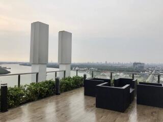 Rooftop with seating area and city view