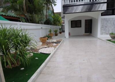 Spacious driveway with landscaped garden