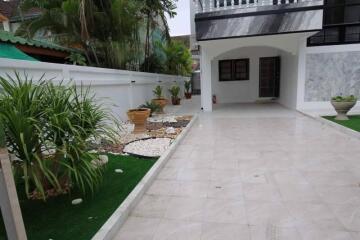 Spacious driveway with landscaped garden