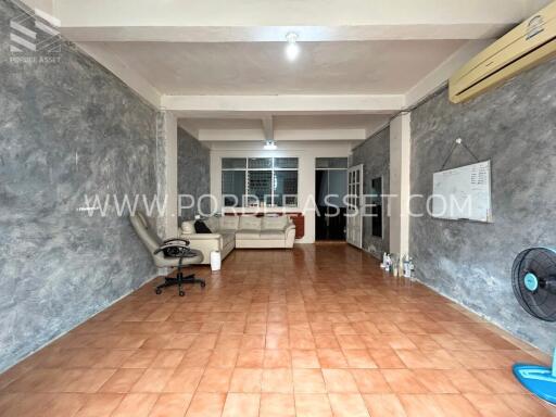 Spacious living room with tiled flooring and modern decor