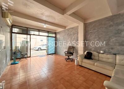 Spacious living room with large windows