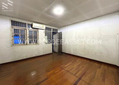 Empty bedroom with wooden floor