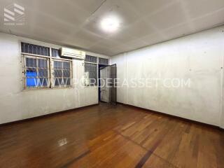 Empty bedroom with wooden floor