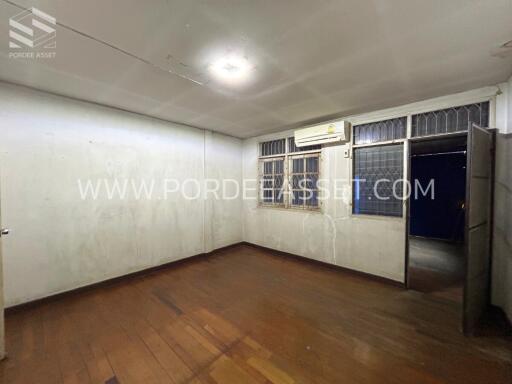 Empty bedroom with wooden floor