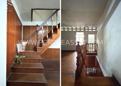 Interior view of a staircase with wooden steps and handrails