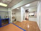 Spacious kitchen area with tiled floor and built-in sink