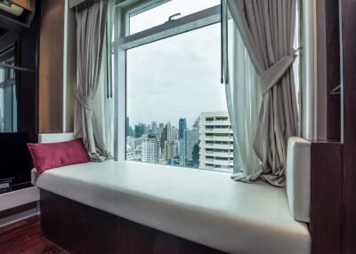 Modern living room with a city view from a large window