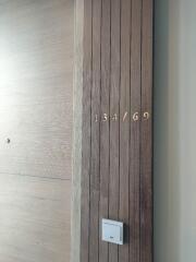 Apartment entrance displaying the unit number 134/69