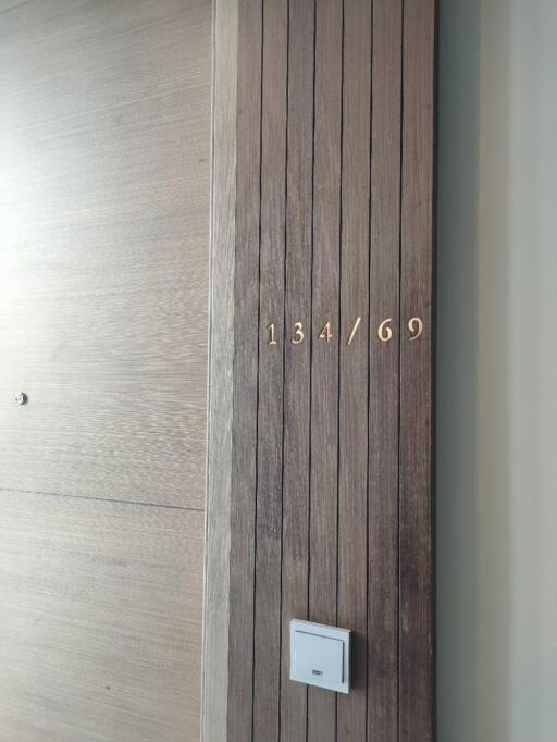 Apartment entrance displaying the unit number 134/69