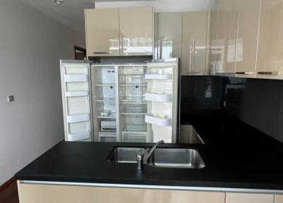 Modern kitchen with built-in appliances and sleek cabinetry