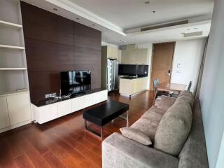 Modern living room with furniture and kitchen area view