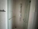 Modern shower enclosure with glass doors