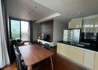 Spacious and modern open-plan living area with kitchen, dining, and sitting area.